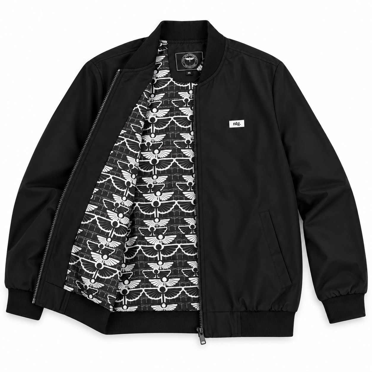 Black Arterial bomber jacket laid open on a white background, showing the black-and-white printed lining.