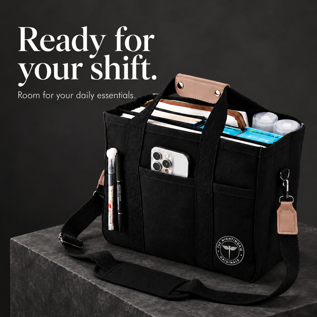 Black Satch’l clinical tote packed with notebooks, a phone and work essentials beside a Ready for your shift caption.