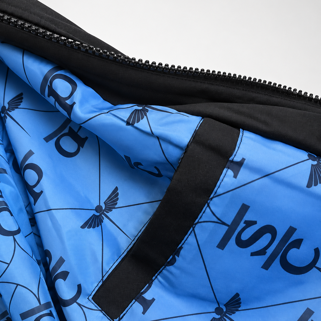 Close-up of the Venous Blue medical-print lining and black-trimmed interior pocket.